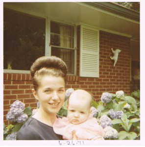 Momcat holding me outside my grandparents' house.